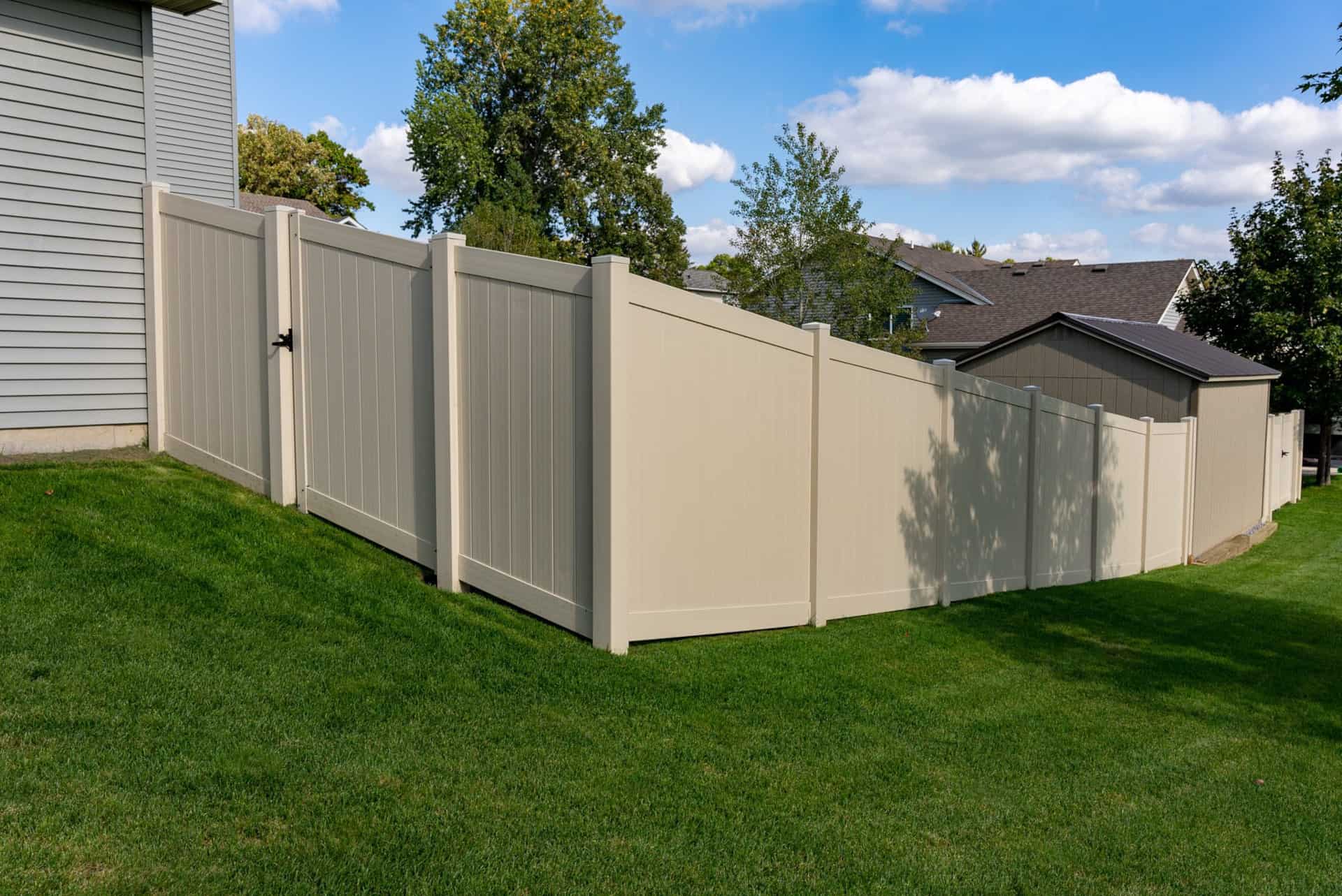 fencing on a slope - tan vinyl privacy apple valley